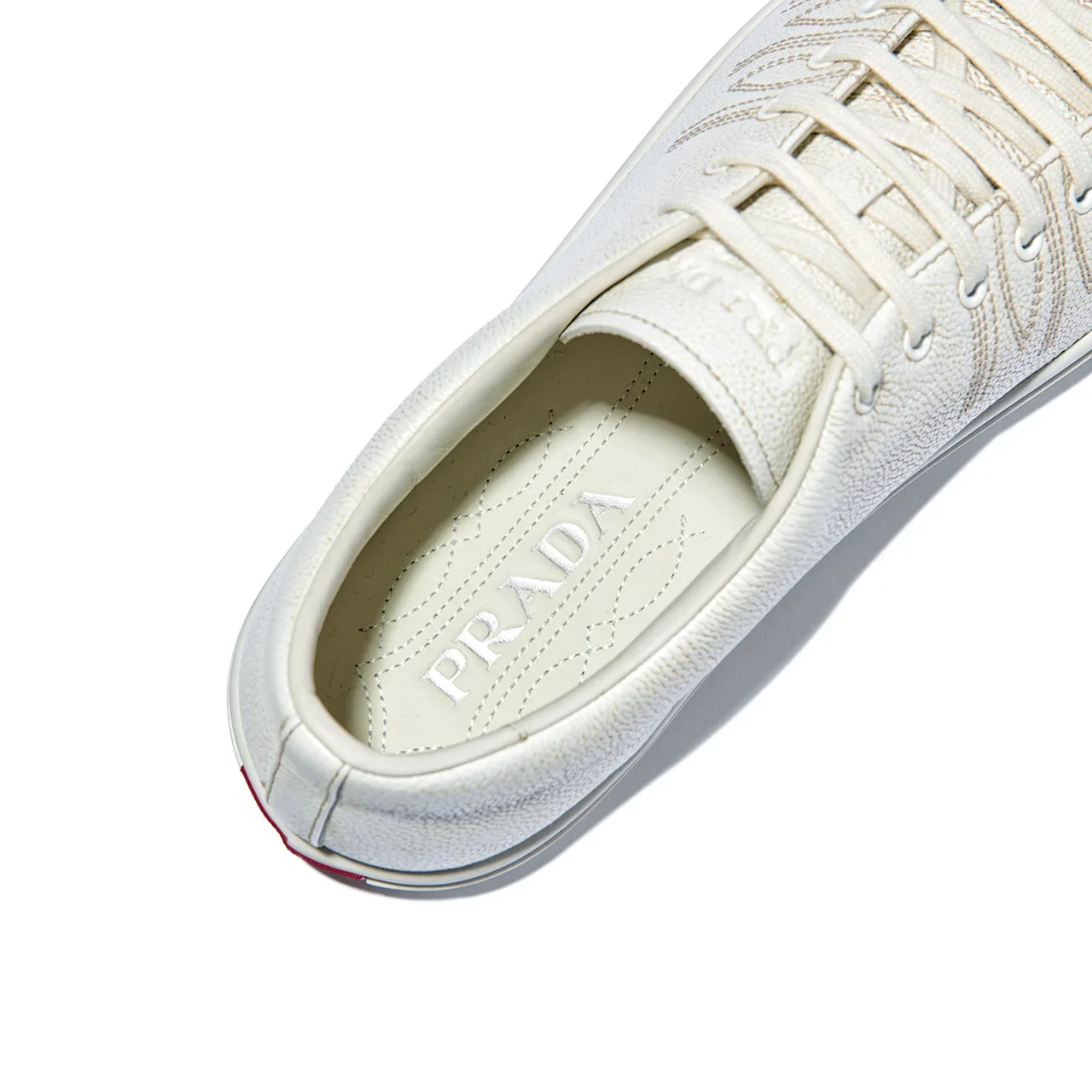 PRADA｜Aged-effect leather sneakers