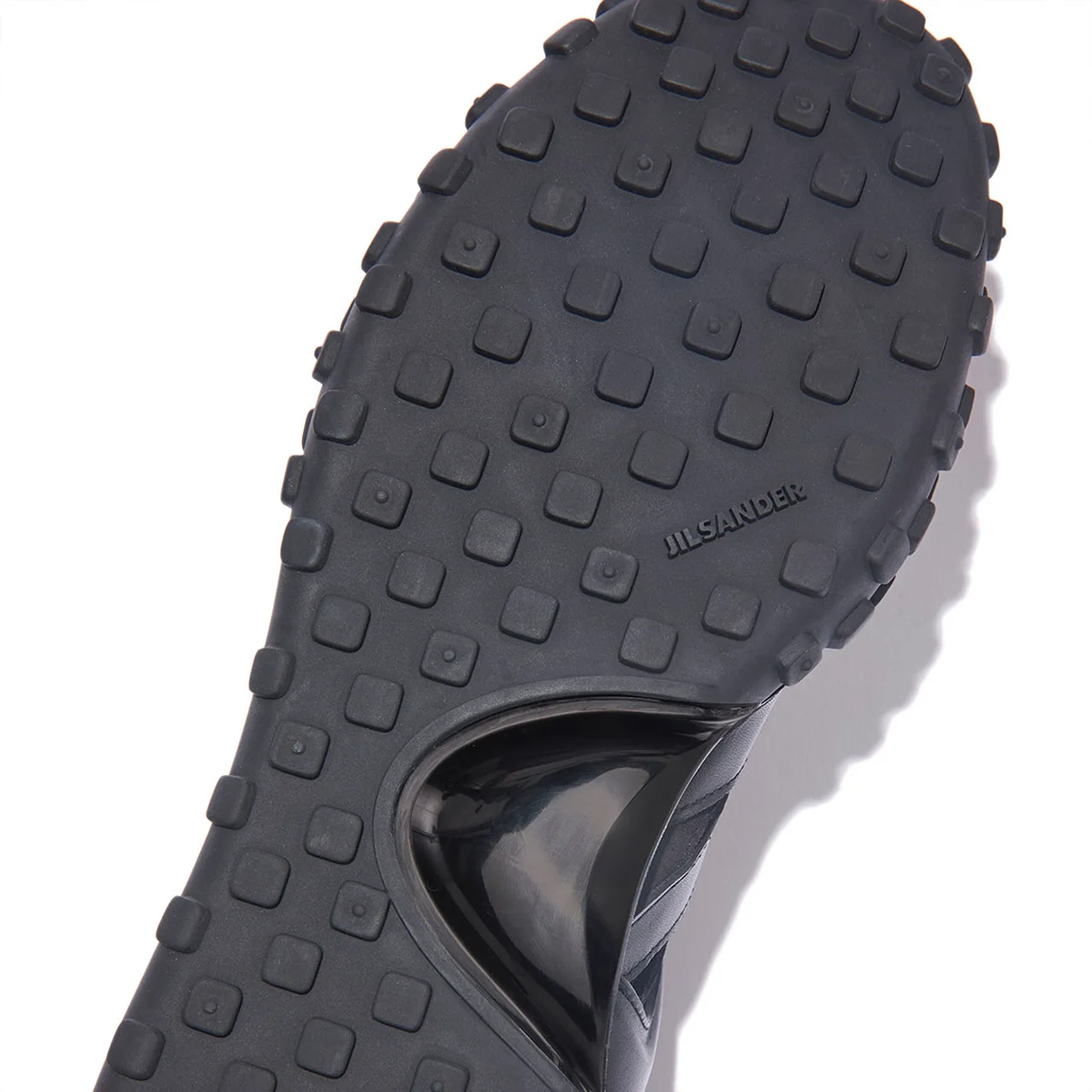 土踏まず部分が半月状にシェイプされたワックスルソール