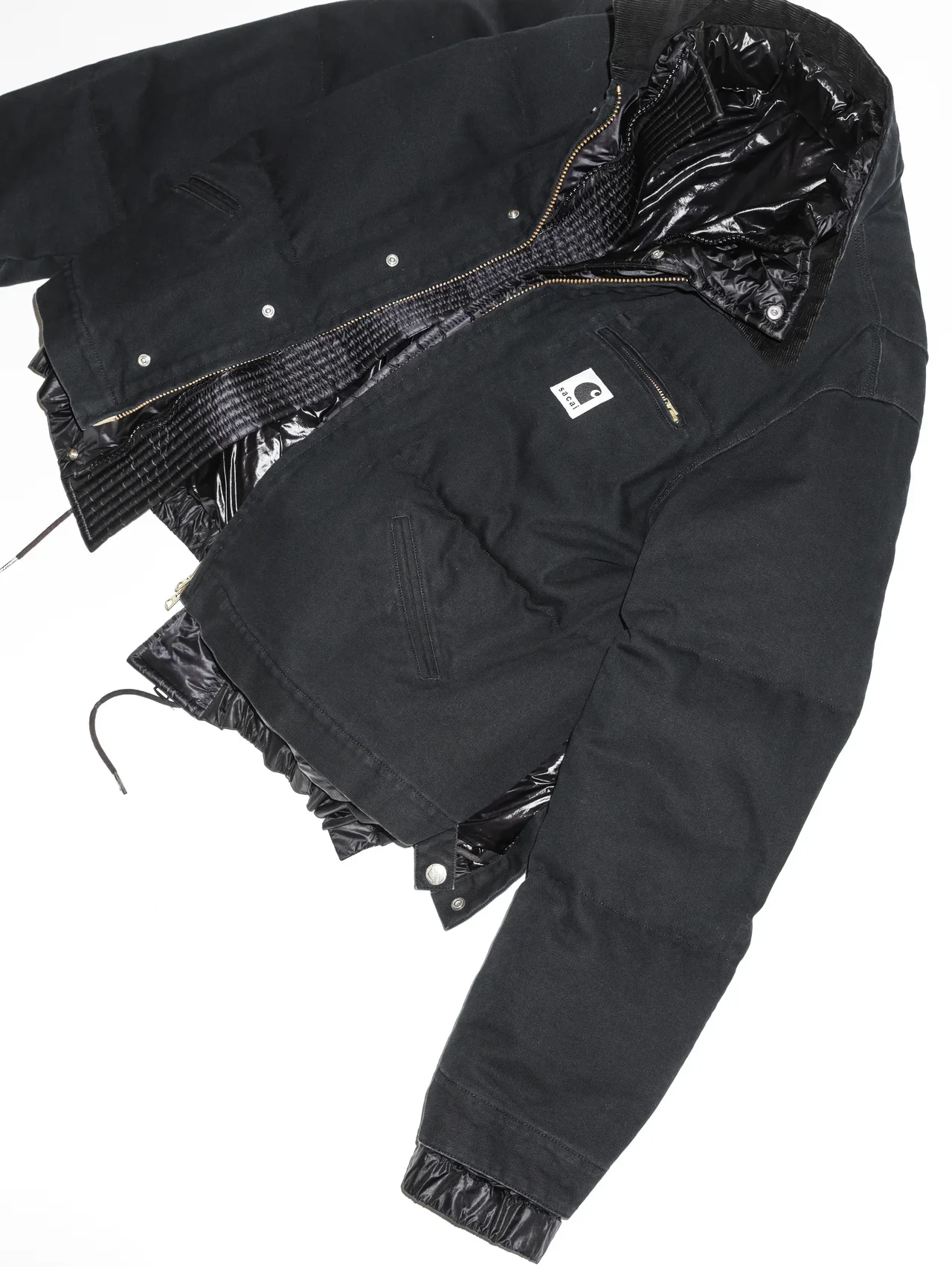 sacai x Carhartt WIPのウォッシュド ダック パファージャケット