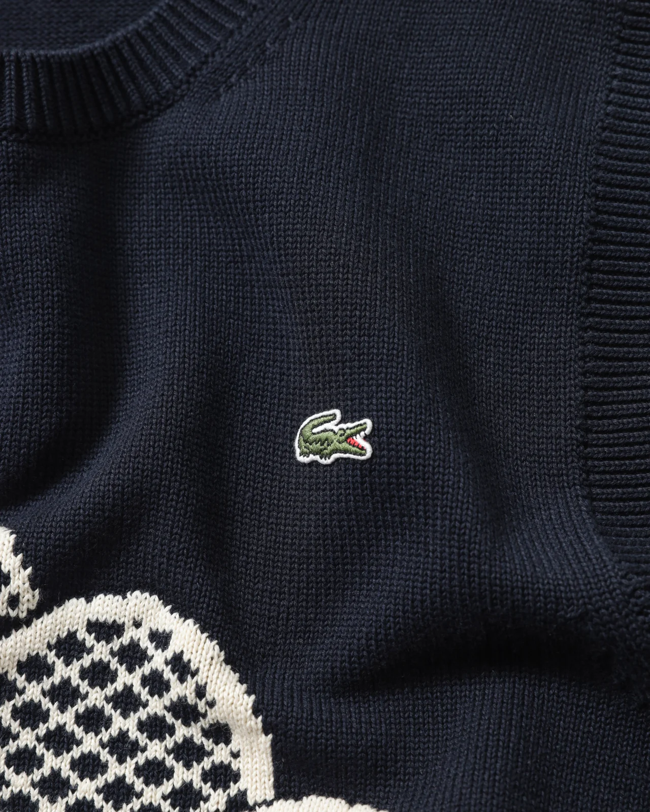 LACOSTEのラケット柄ニットベスト ロゴ